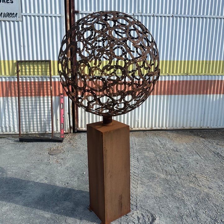 Fortune – Horseshoe Metal Sphere Sculpture on Plinth