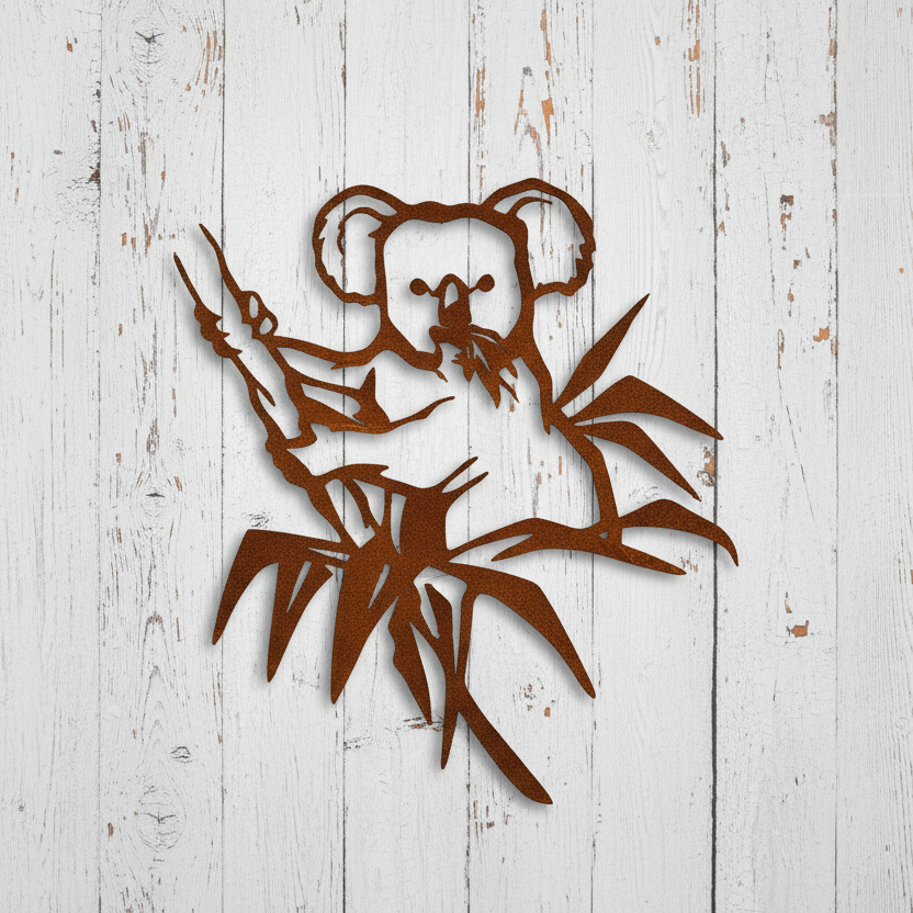 Metal wall art of a koala on a branch with leaves on a wooden background